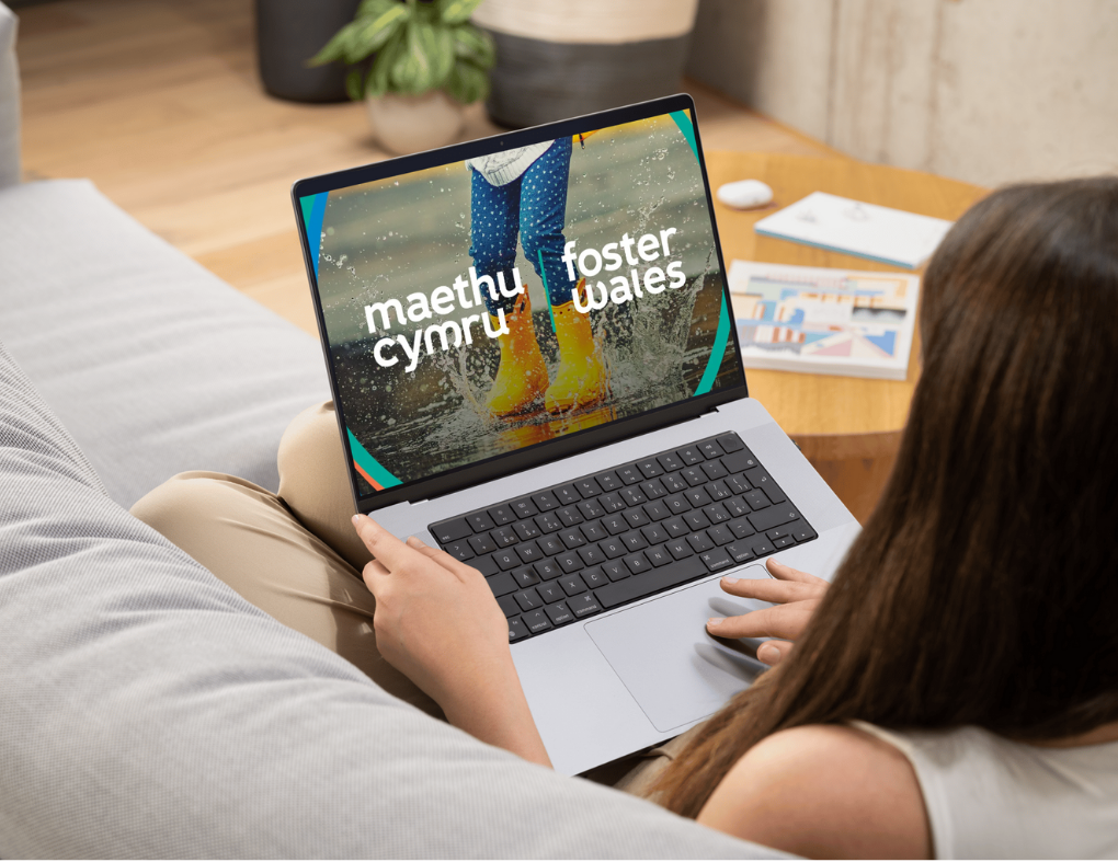 woman on laptop sitting on the sofa