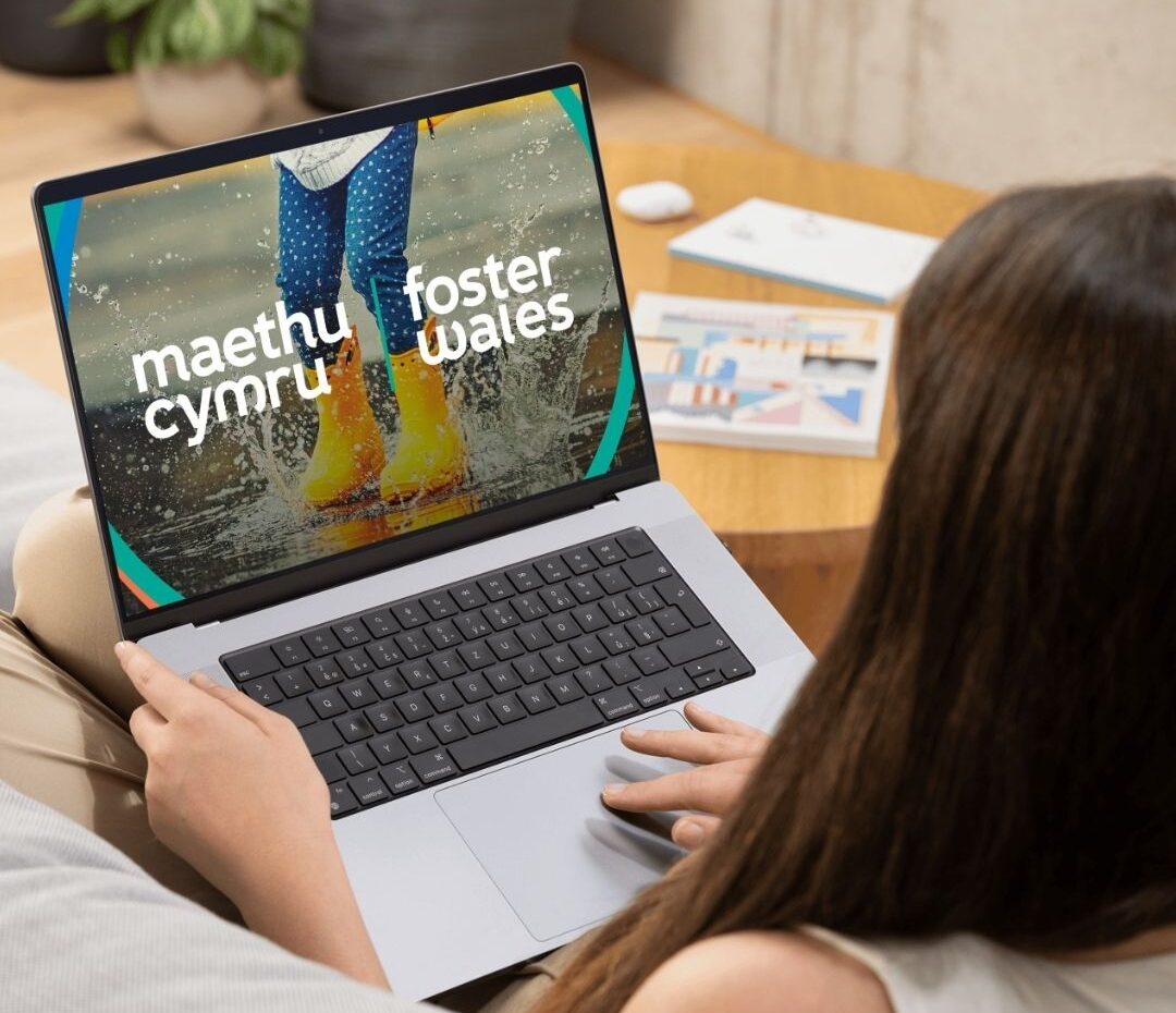 woman sitting on couch with laptop